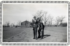 CCC boys with Officer's Quarters in background